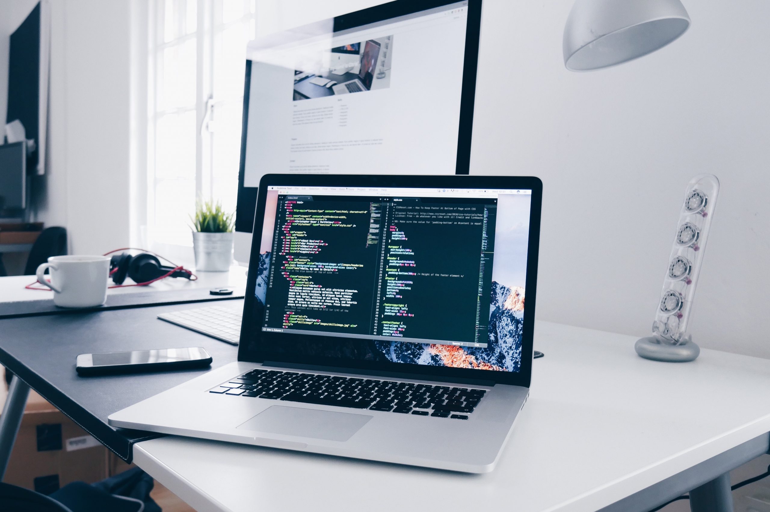 A laptop on a desk Web Support For Businesses