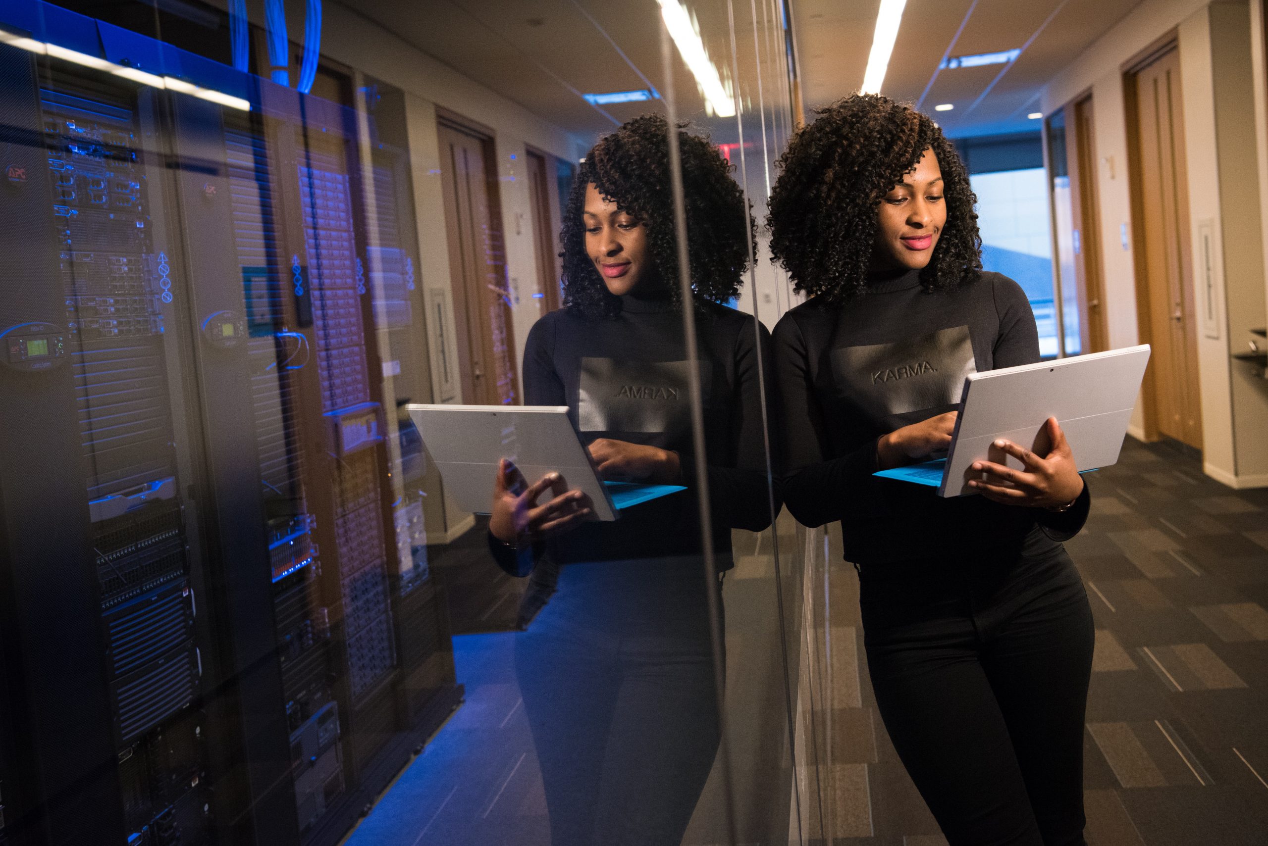 Woman engineer with laptop in data center Cybersecurity for New Jersey
