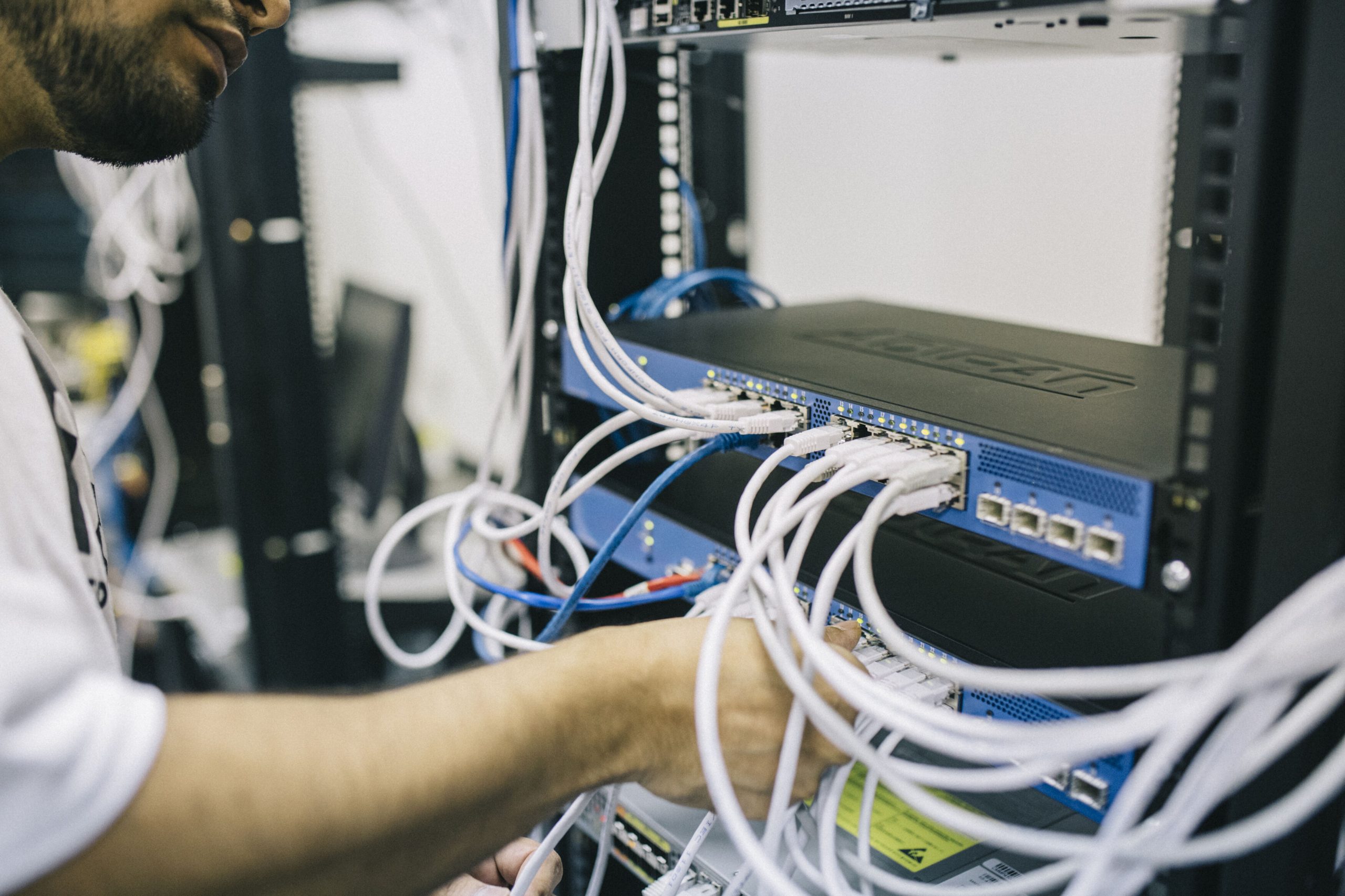 Technician working on network server equipment