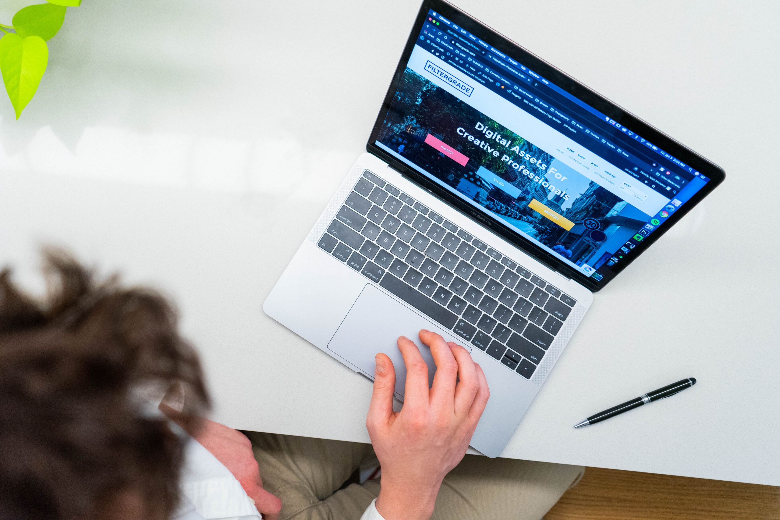Person working on laptop with website on screen SEO